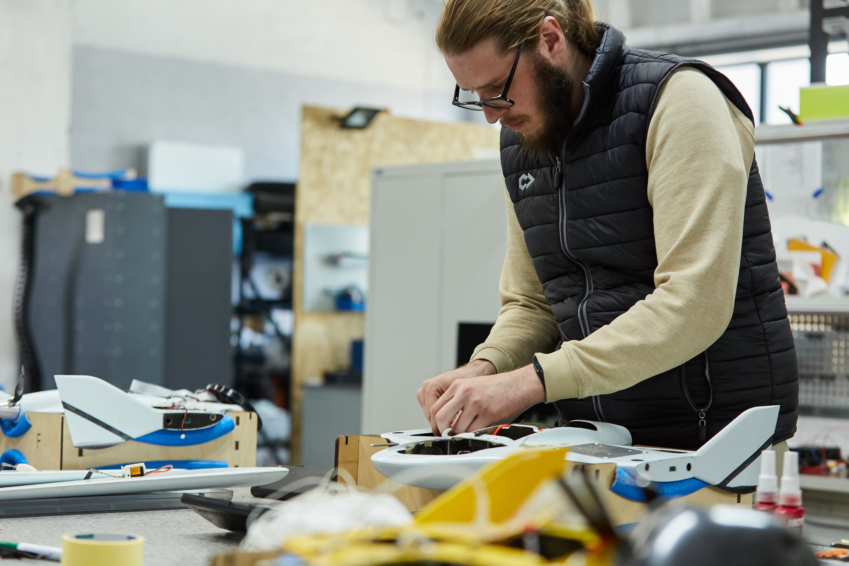 An employee of Culver Aviation makes SKIF UAVs